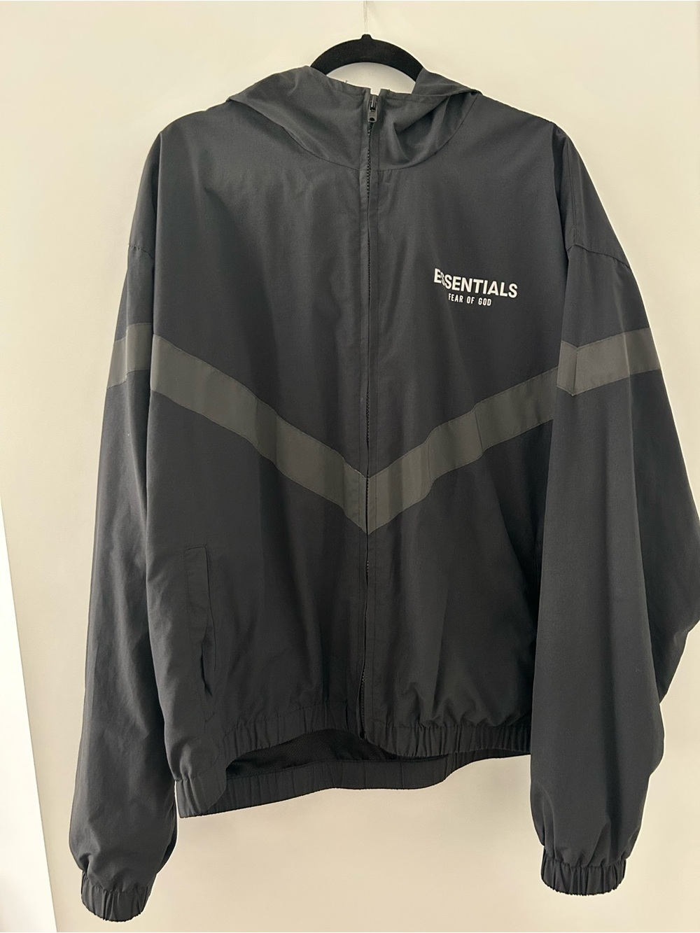 Fear of God Essentials Black Hooded Windbreaker with Dark Gray Chevron